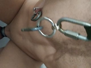 Sissy pees in the shower with heavy iron nipple torture.