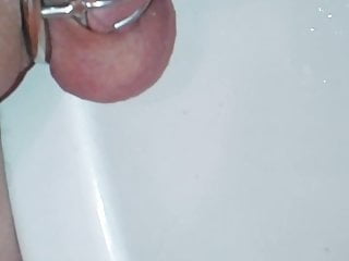 peeing in chastity with a hollow urethral plug