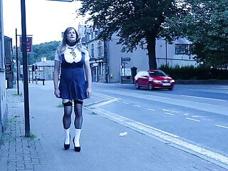 crossdressed in uniform outdoors on a main road 