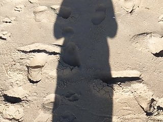 walking in shadow in beach Santa Cruz