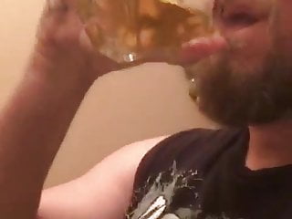 Sissy Cory drinking a class of piss