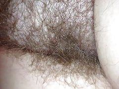 close up of my girls hairy pussy under the sheets.