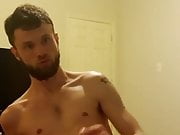 bearded beauty wanks and cums on his bed