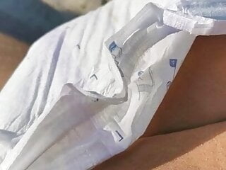 Diaper on public beach and masturbation