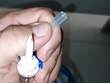 Preparing the stick for application of the serum directly into the glans vein.