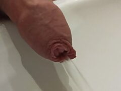 Pissing in a public toilet sink