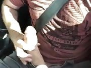 Driving and showing his big cock the world