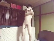 A naked Japanese man is dancing koi dance