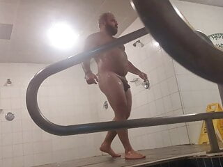 Sexy bear in the public gym showers