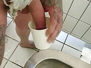 Barefoot on a public toilet