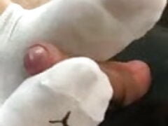 Footjob inside of car in white puma socks