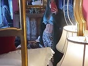 Bella Thorne admiring her abs in a mirror