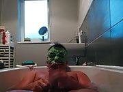 Bath wank with mask on 