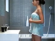 girl in a babydoll strips before shower