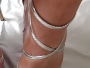 Oiled Feets with silver Toes in silver strappy Stilettos