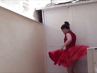 Brunette woman in red skirt dress...