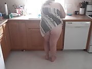 Nude wife in kitchen