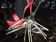 Lady L crush umbrella with sexy red high heels.