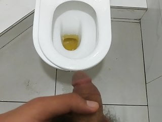 Teen boy peeing in toilet...