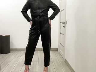 Tranny In A Leather Jumpsuit Romper And High Heels Bdsm
