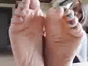 Blue nail polish soles of a blonde