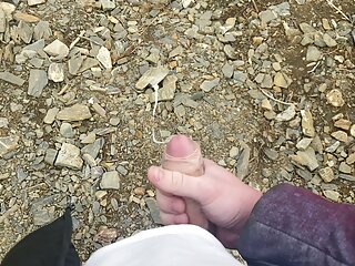 I jerk off a flaccid dick and cum on a mountain lake in nature! POV!