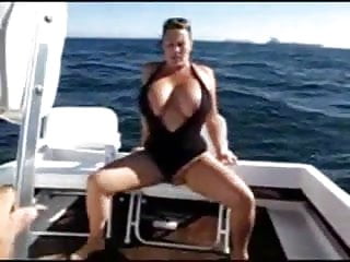 Busty woman getting herself off boat...
