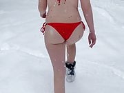 Bubble butt in bikini walking in snow 