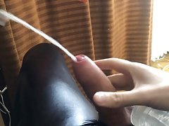 Huge cumshot with used fleshlight in rubber suit