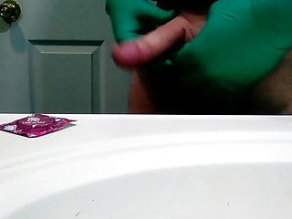 Green surgical gloves and condom