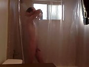 Twink takes shower while being recorded 