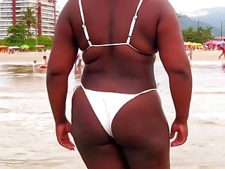 Cute black milf in the beach...